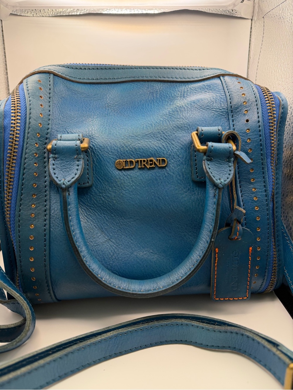 Old Trend Blue Leather Crossbody Bag with Gold Accents